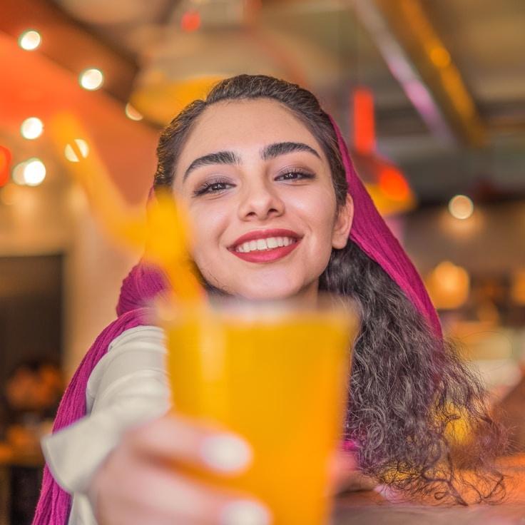 Avery Chen, Lead Design Curator at Subtle Meadow Path, reviewing corporate floral arrangements